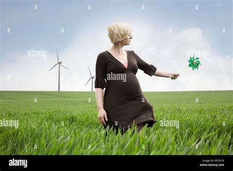 Pregnant Woman Playing With Windmill Stock Photo Alamy