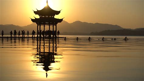 Chinese Ancient Pavilion In Beautiful Sunsetat Hangzhou Citychina