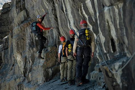 A Group Of Climbers Ascend A Rock Pitch Photograph By Topher Donahue