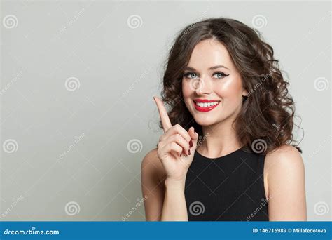 Pretty Brunette Woman Pointing Up And Smiling Stock Image Image Of Finger Healthy 146716989
