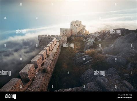 Medieval Fortress Wall And Tower Landscape With Cloudy Sky Stock Photo