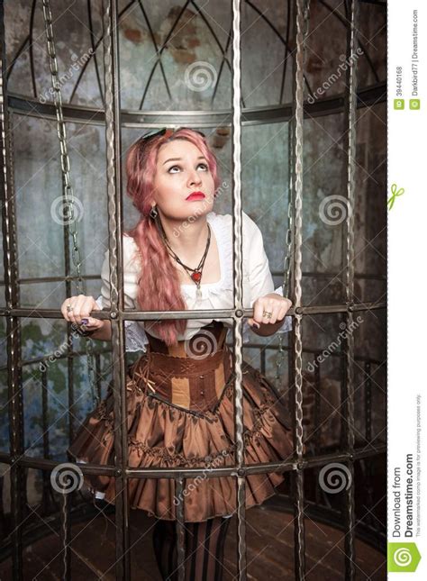 Frightened Beautiful Steampunk Woman In The Cage Stock Photo Steampunk Women Steampunk