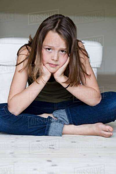 Portrait Of Unhappy Twelve Year Old Girl With Head In Hands Stock Photo Dissolve