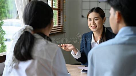 professional asian female manager or hr recruiter interviewing two candidates in the office