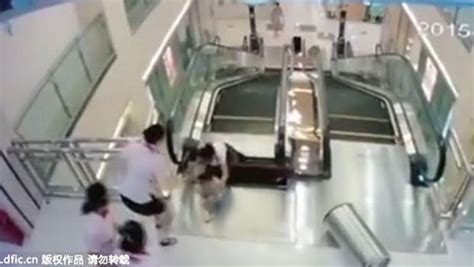 Chinese Woman Dies On Escalator But Saves Son Cbs News
