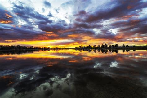 Colorful Sunrise Reflecting In A Colorado Lake Along The Front Range