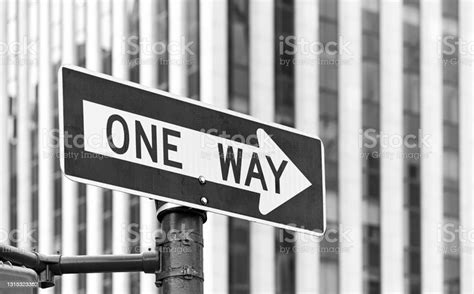 Black And White Picture Of A One Way Traffic Sign Stock Photo