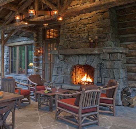 Incredibly Rustic Outdoor Porch With A Beautiful Large Fireplace In