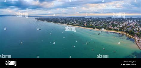 Aerial Panorama Of Sorrento Suburb Coastline With Moored Boats And