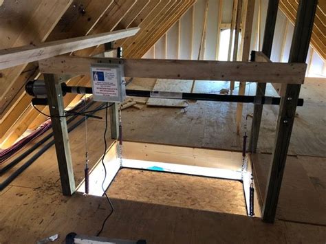 An Attic Is Being Built With Wood And Metal Framing On The Floor Along