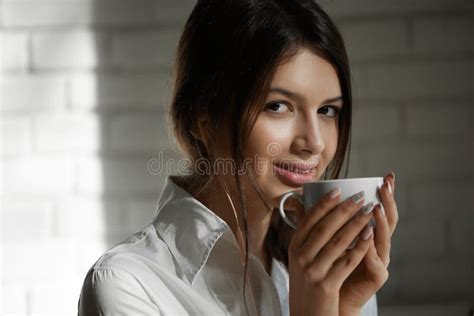 Pretty Smiling Girl Drinking Coffee In The Morning Stock Photo Image