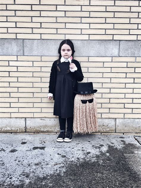 Maybe you would like to learn more about one of these? Kids Wednesday Addams and Cousin It Halloween costume #diy #livelovesara #halloweencostume # ...