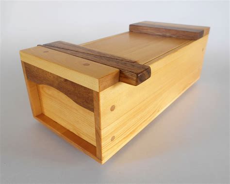 A Wooden Box Sitting On Top Of A Table