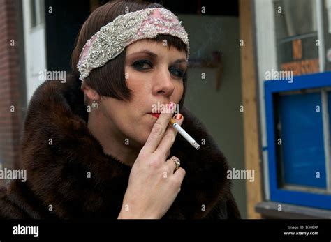 Retro Chic Woman Smoking On A City Street In A Fur Coat Stock Photo Alamy