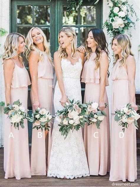 The Bridesmaids Are All Wearing Pink Dresses And Holding Bouquets In