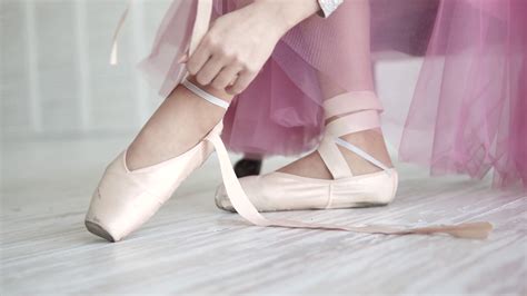Ballerina Tying The Pointes Ballet Dancer Wearing Ballet Shoes In The