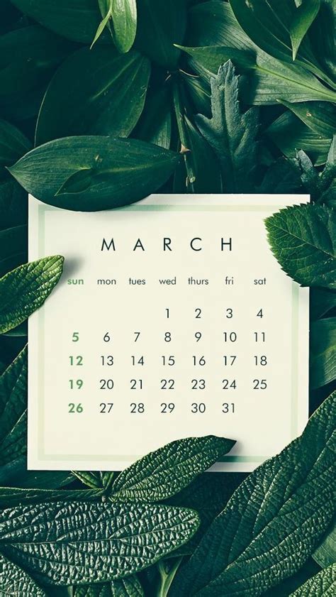 The March Calendar Is Surrounded By Green Leaves