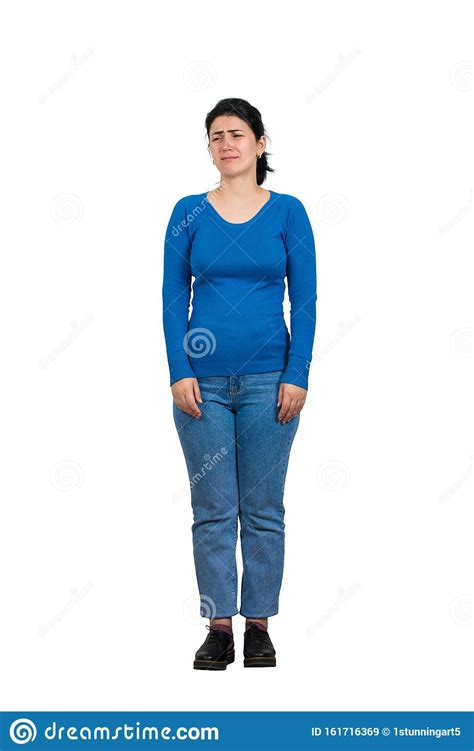 Full Length Portrait Of Sad Young Woman Crying Looking Aside As Feel