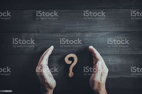 Hands Protect Wooden Question Mark On Wood Table Background Problem