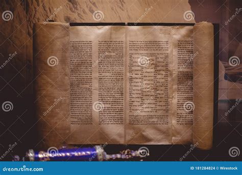 Closeup Of A Hebrew Bible Written On A Parchment Roll On The Table