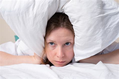 Insomnia Bad Sleep Migraine Headache A Woman In Bed Covered Herself