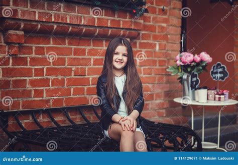 Girl Sitting Near Bricks Wall Background Stock Image Image Of Little