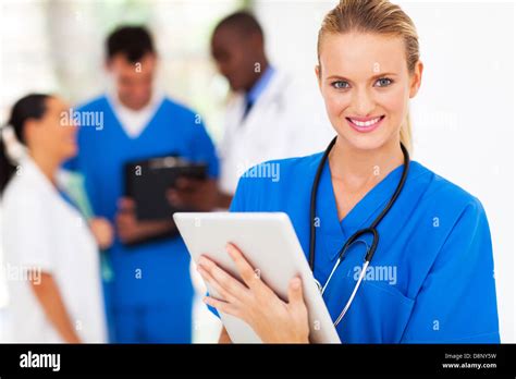 Pretty Medical Nurse With Tablet Computer In Hospital Stock Photo Alamy