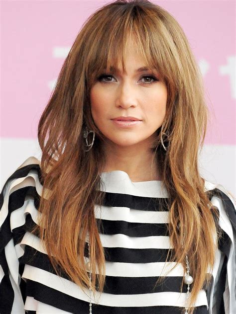 If you can't decide between lengths, you don't have to worry about being pushed out of your comfort. Jennifer Lopez Long Layered Wig With Wispy Bangs - Rewigs.com