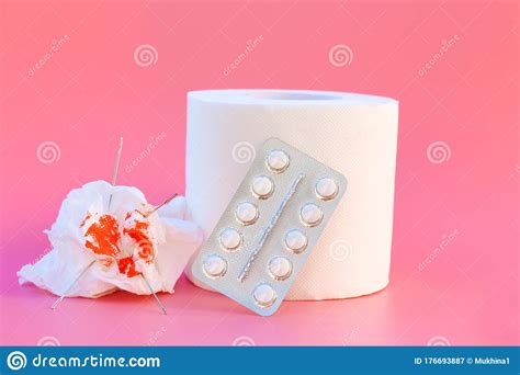 Toilet Paper Pills And Blood Concept Of Hemorrhoid Treatment Stock
