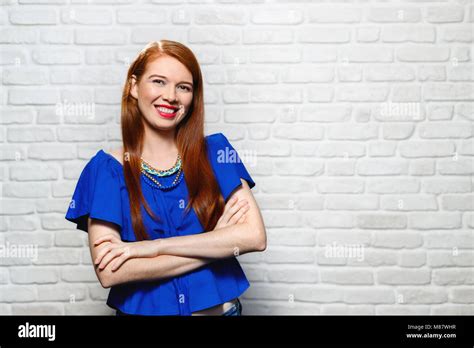 Facial Expressions Of Young Redhead Woman On Brick Wall Stock Photo Alamy