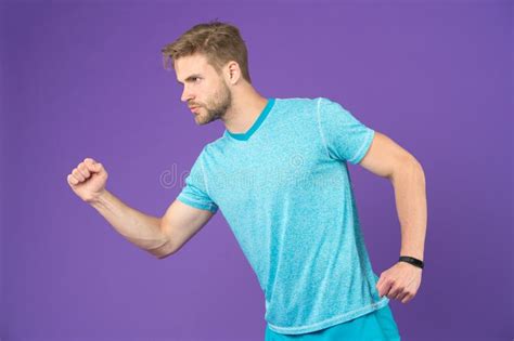 Man In Tshirt And Shorts On Violet Background Runner In Blue Casual