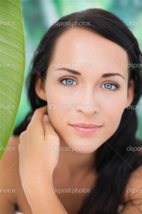 Beautiful Nude Brunette Smiling At Camera With Green Leaf Stock Photo