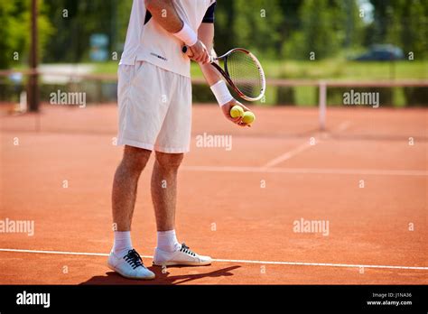 Male Tennis Player Serving On Clay Tennis Court Stock Photo Alamy
