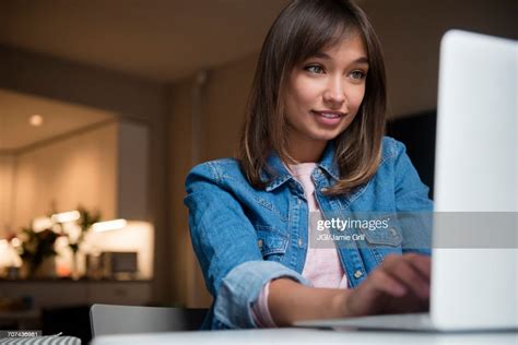 Mixed Race Woman Using Laptop High Res Stock Photo Getty Images