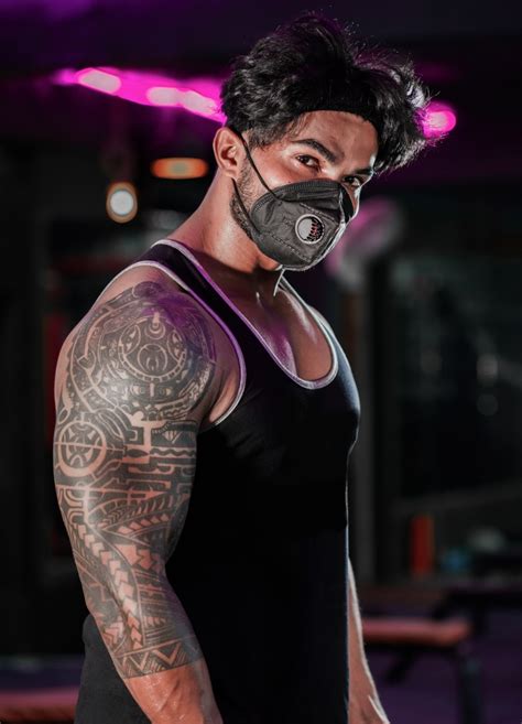 bodybuilder wearing mask at gym pixahive