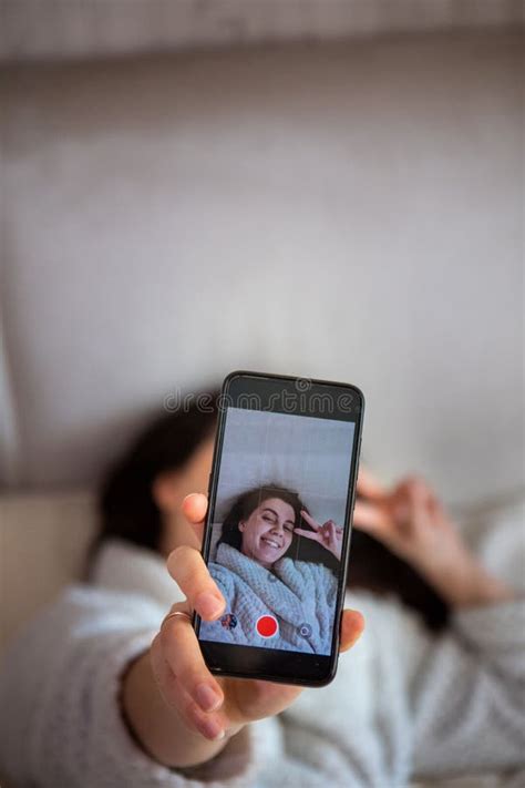 Young Happy Woman Taking Selfie Story Laying Down In Bed Stock Image Image Of Emotions White