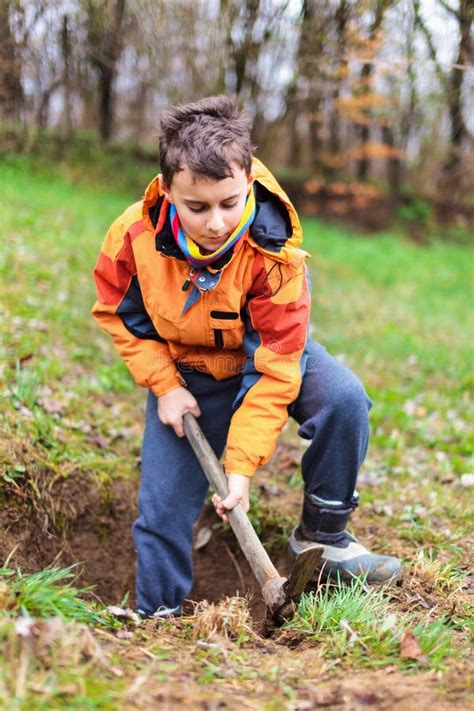 Boy Digging In The Ground Stock Photo Image Of Happy 24325106