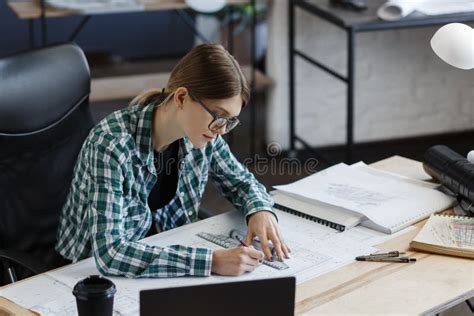 Architect Drawing Blueprints In Office Engineer Sketching A