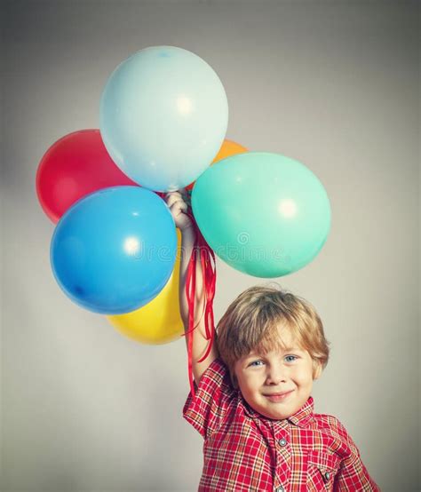 Boy Holding The Bunch Of Balloons Stock Image Image Of Colors