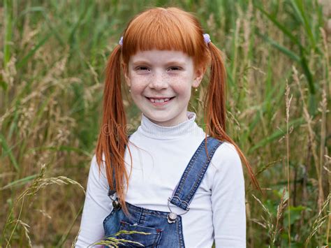 Redhead Little Girl With Freckles Smiles Brightly Stock Photo Image