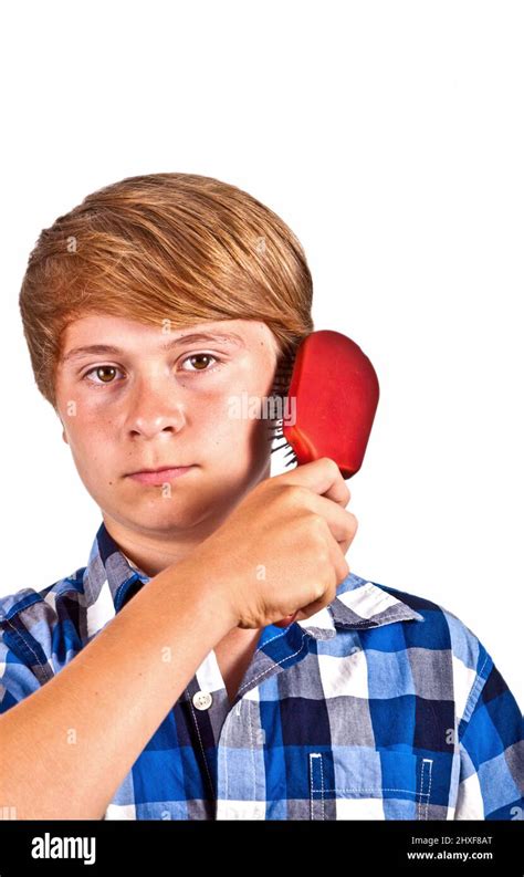 Young Boy Brushing His Hair Stock Photo Alamy