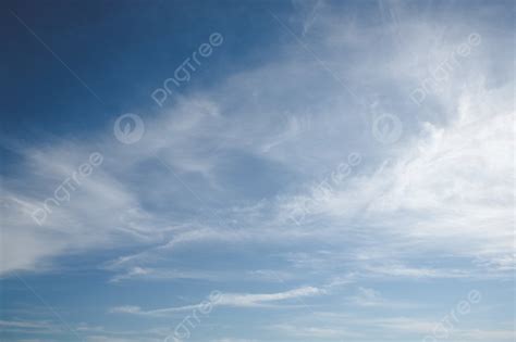 Blue Sky With Soft White Clouds In The Summer Photo Background And