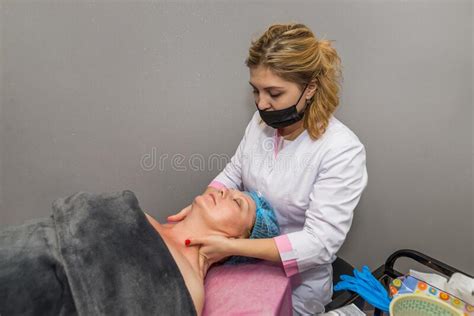Beautician Makes A Manual Facial Massage To A Woman Stock Photo Image