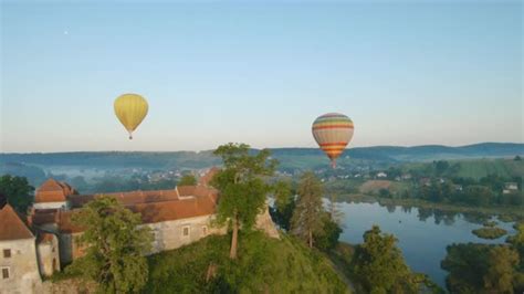 Colorful Hot Air Balloons Fly Over The Medieval Castle And Lake In The