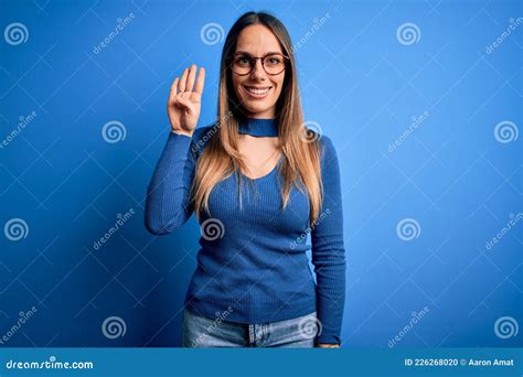 Young Beautiful Blonde Woman With Blue Eyes Wearing Glasses Standing