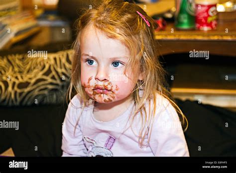 Little Girl With Chocolate Around Mouth Stock Photo Alamy