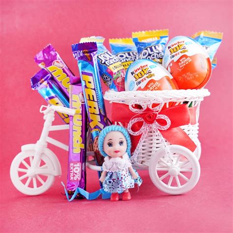 Send Kids Doll Rakhi With Chocolates And Lollies Online
