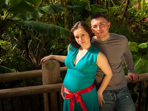 Premium Photo Pregnant Woman And Husband Spending Time In The Garden