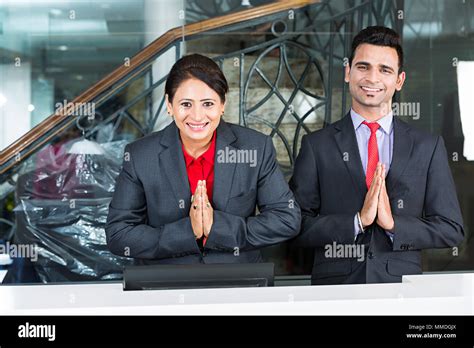 Two Receptionist Colleague S Employees Joined Hands Greeting Welcome In