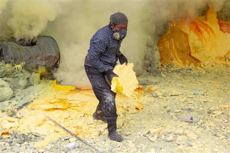 Ijen Sulfur Miner At The Ijen Volcano In Indonesia
